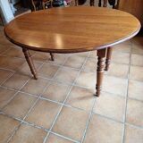 Beautiful oval wooden table with turned wooden leg with 3 extensions