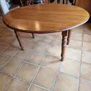 Beautiful oval wooden table with turned wooden leg with 3 extensions