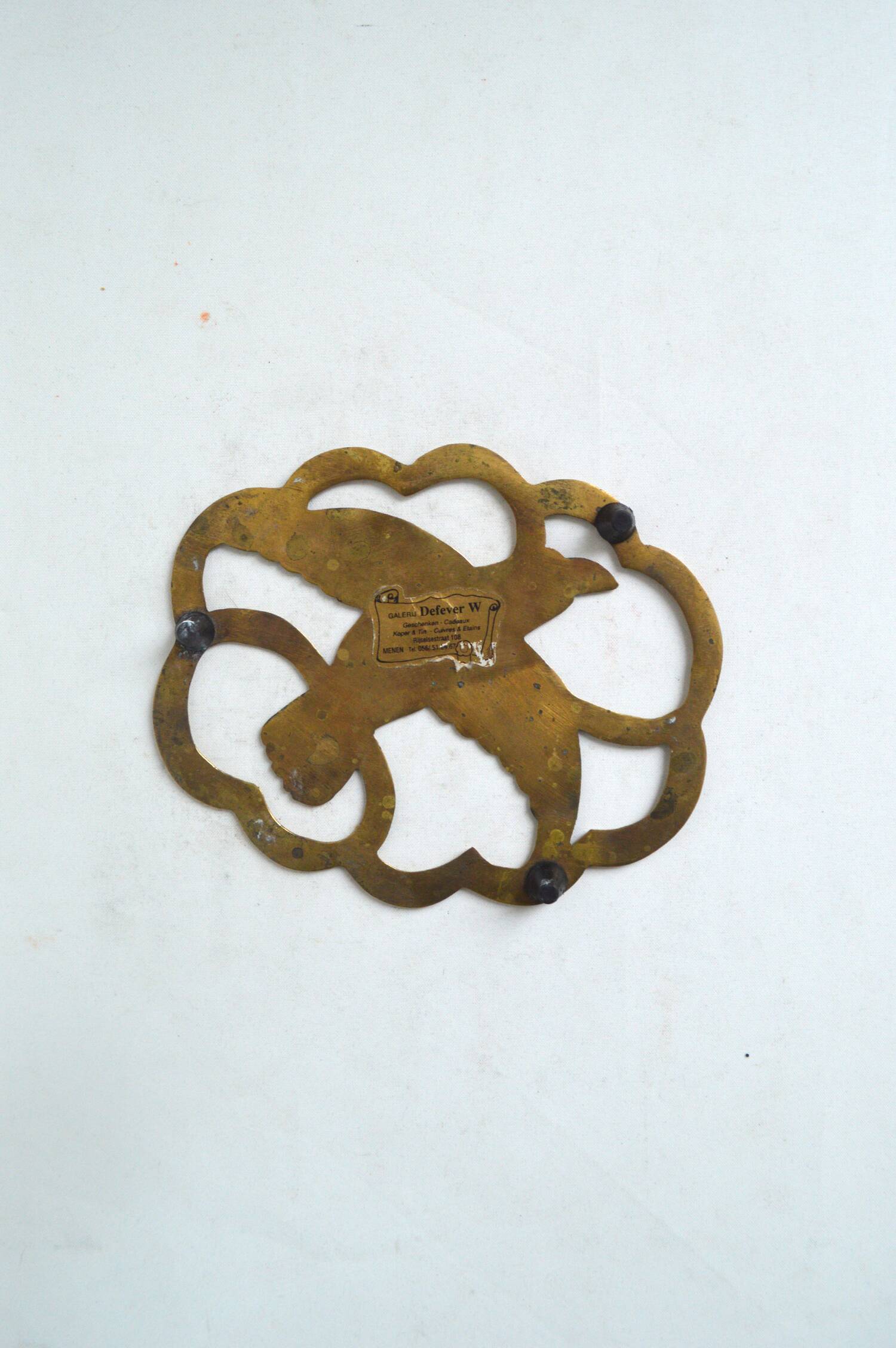 Brass bird trivet