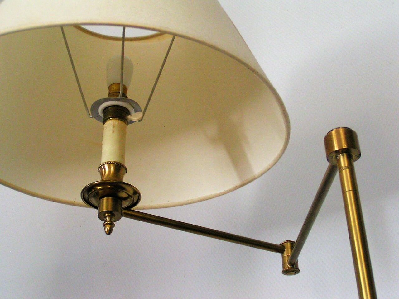 Articulated brass floor lamp