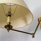 Articulated brass floor lamp