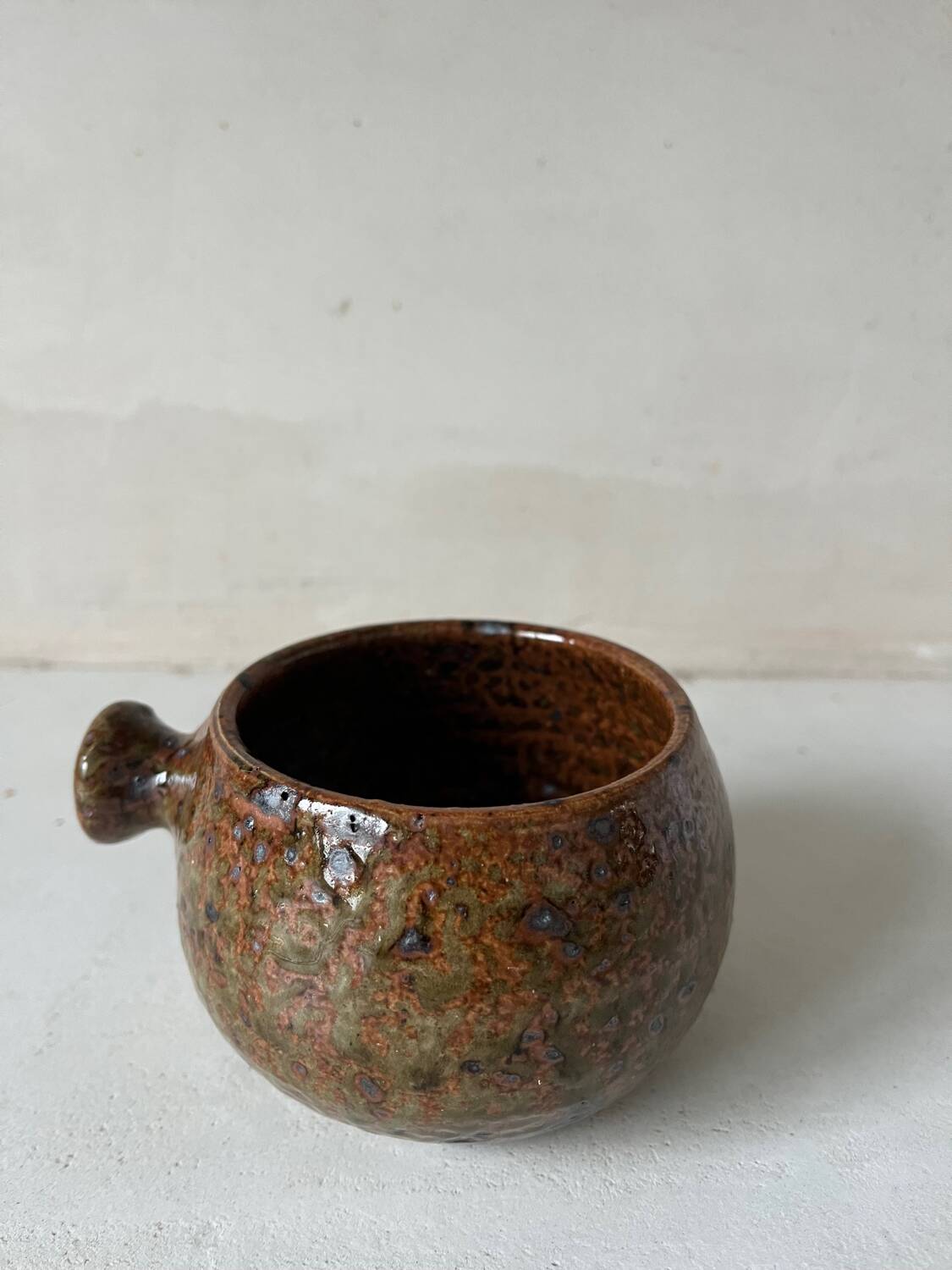 Old pyrite stoneware fondue pot