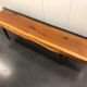 Wooden yew timbered bench stamped Reynolds of Ludlow, circa 1960