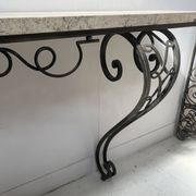 Art Deco console in hammered wrought iron, 20th century.
