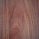 Round wooden table with thin legs