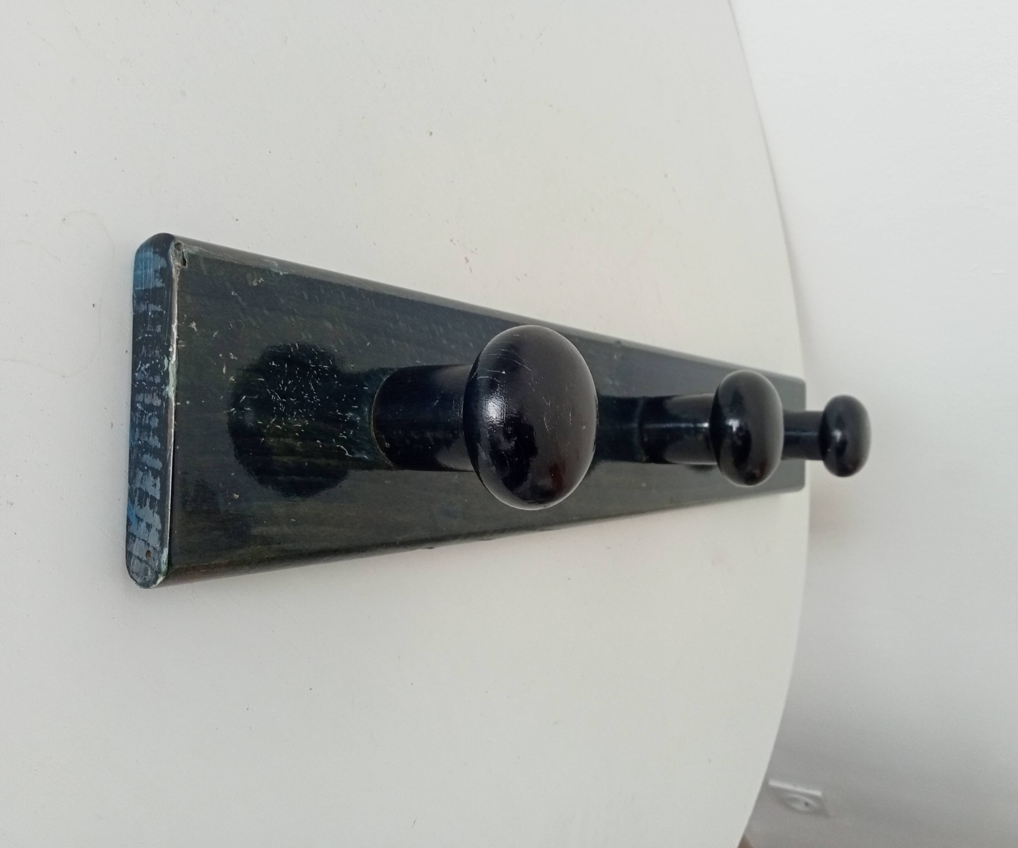 Vintage wall-mounted coat rack in lacquered wood from the 60s