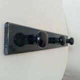 Vintage wall-mounted coat rack in lacquered wood from the 60s