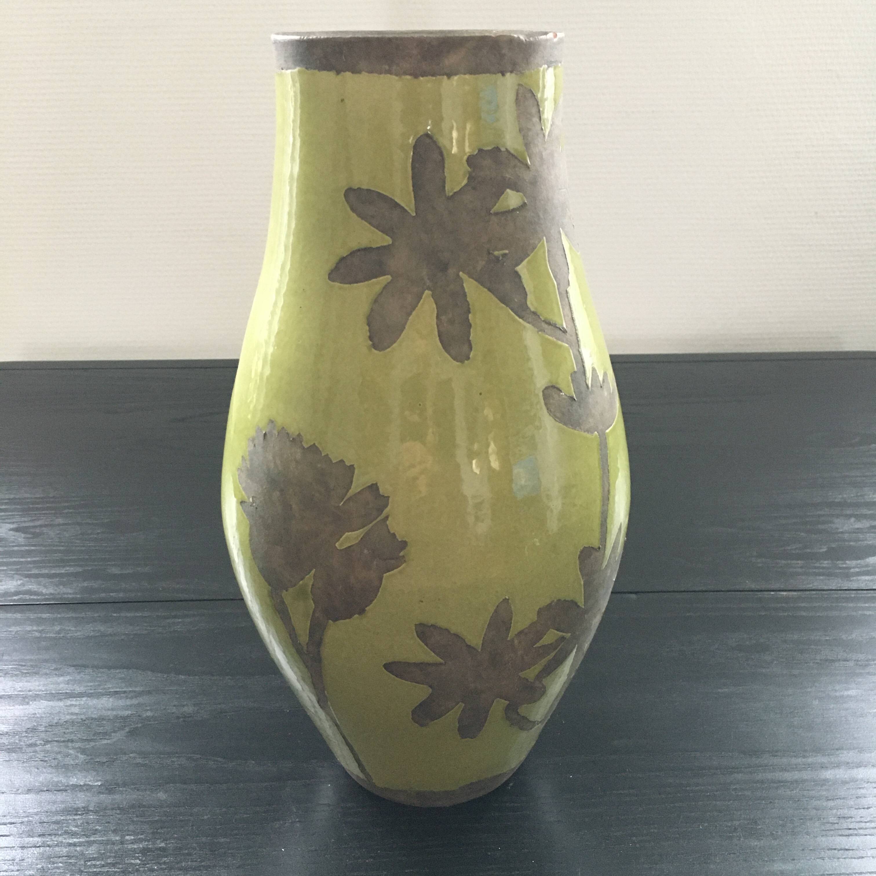 Large green vase with floral decoration