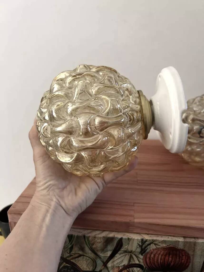 Pair of golden Scandinavian globe wall lights
