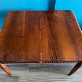 Old table in varnished solid wood