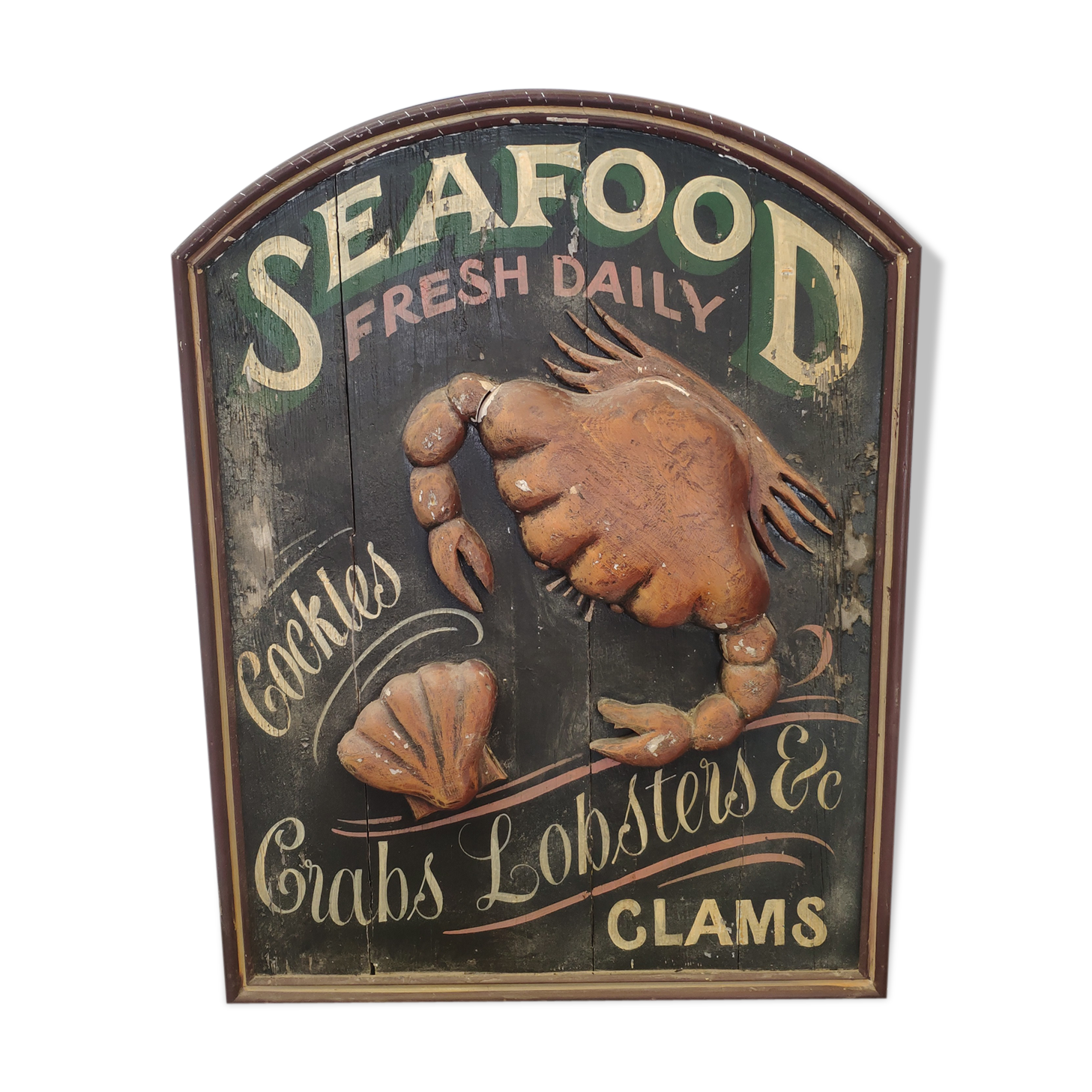 Former Seafood restaurant sign in rare relief
