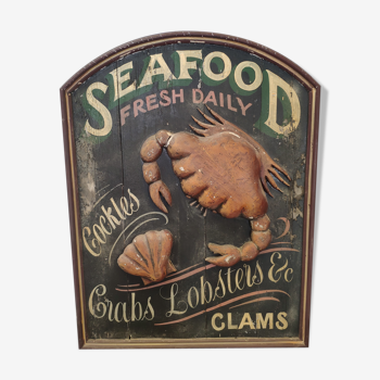 Former Seafood restaurant sign in rare relief