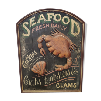 Former Seafood restaurant sign in rare relief