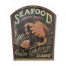 Former Seafood restaurant sign in rare relief