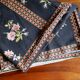Black tablecloth with bouquets of roses
