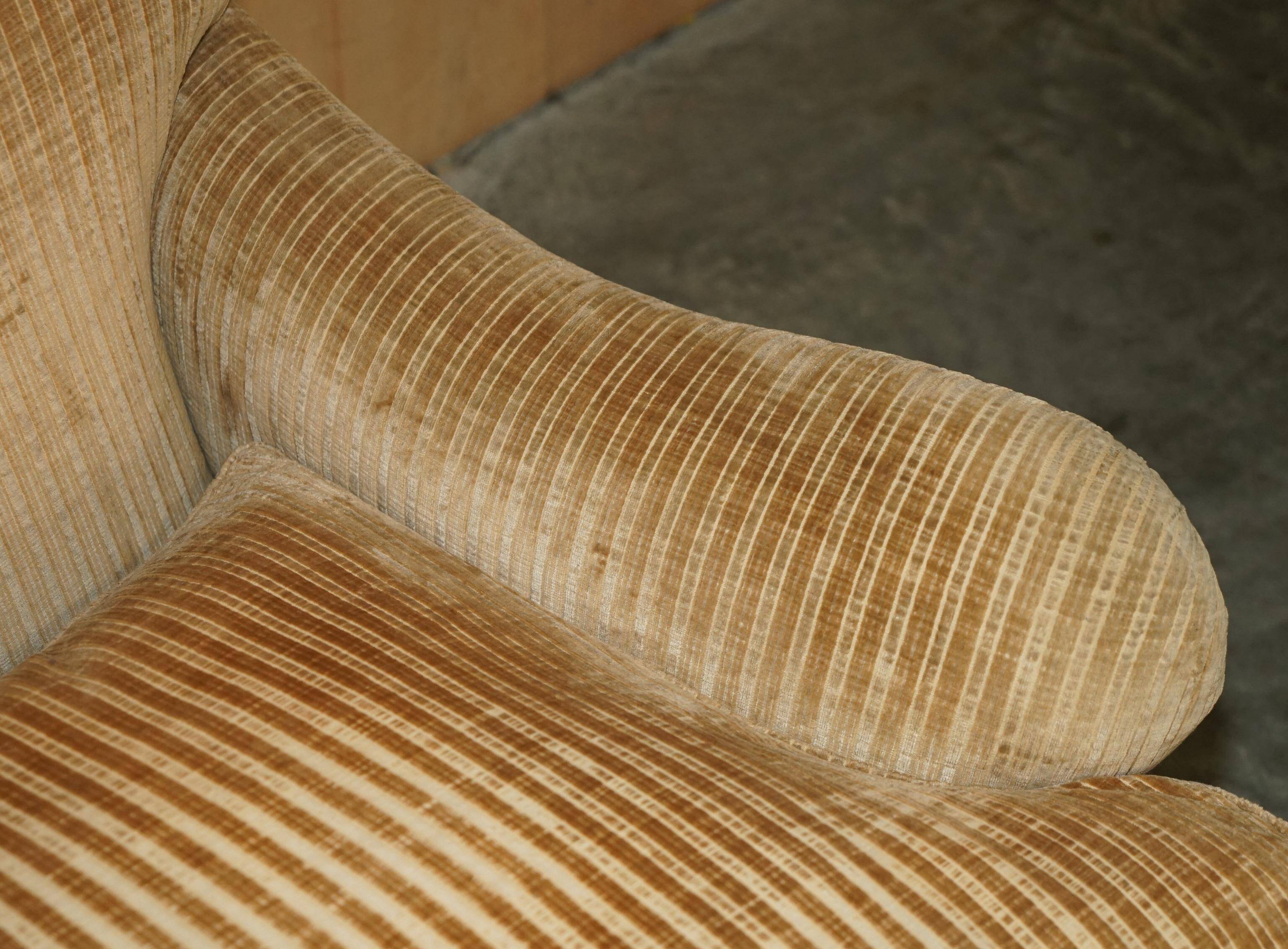 Howard & Sons / Chairs Ltd two-seater canapé with feather-filled cushions.
