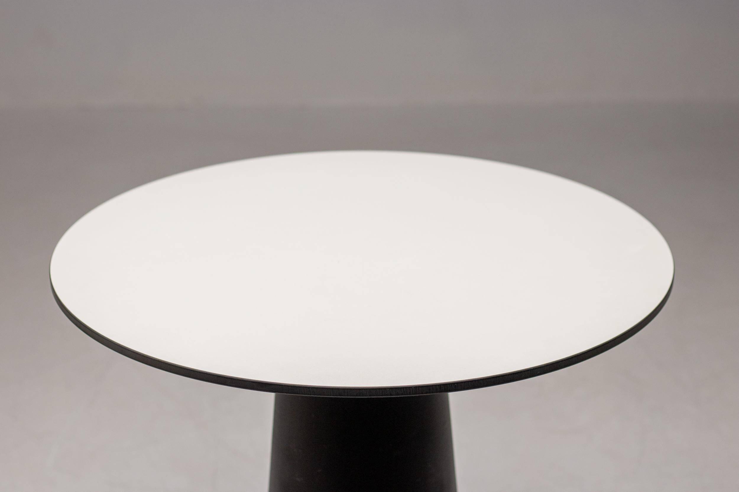 Dining table Container Marcel Wanders, black base and white top.