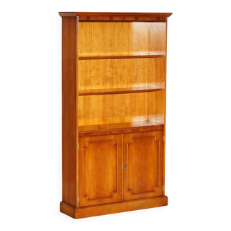 Open library Bradley Furniture made of yew wood with a cupboard base.