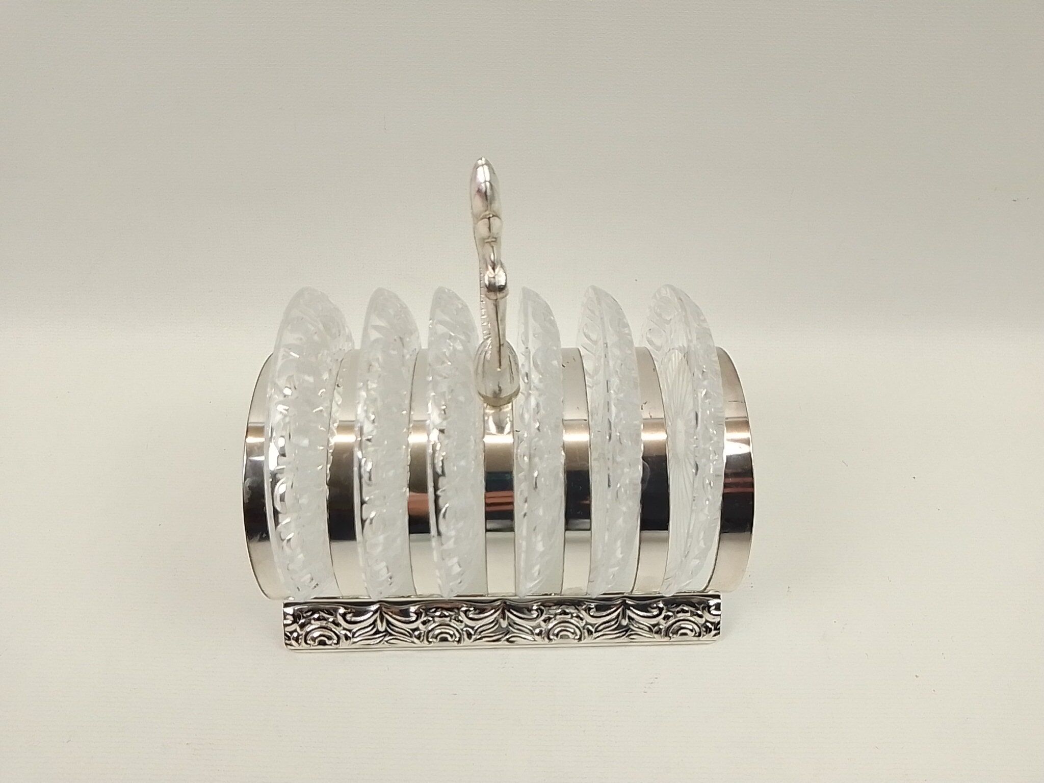 6 glass coasters and silver metal holder