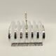 6 glass coasters and silver metal holder
