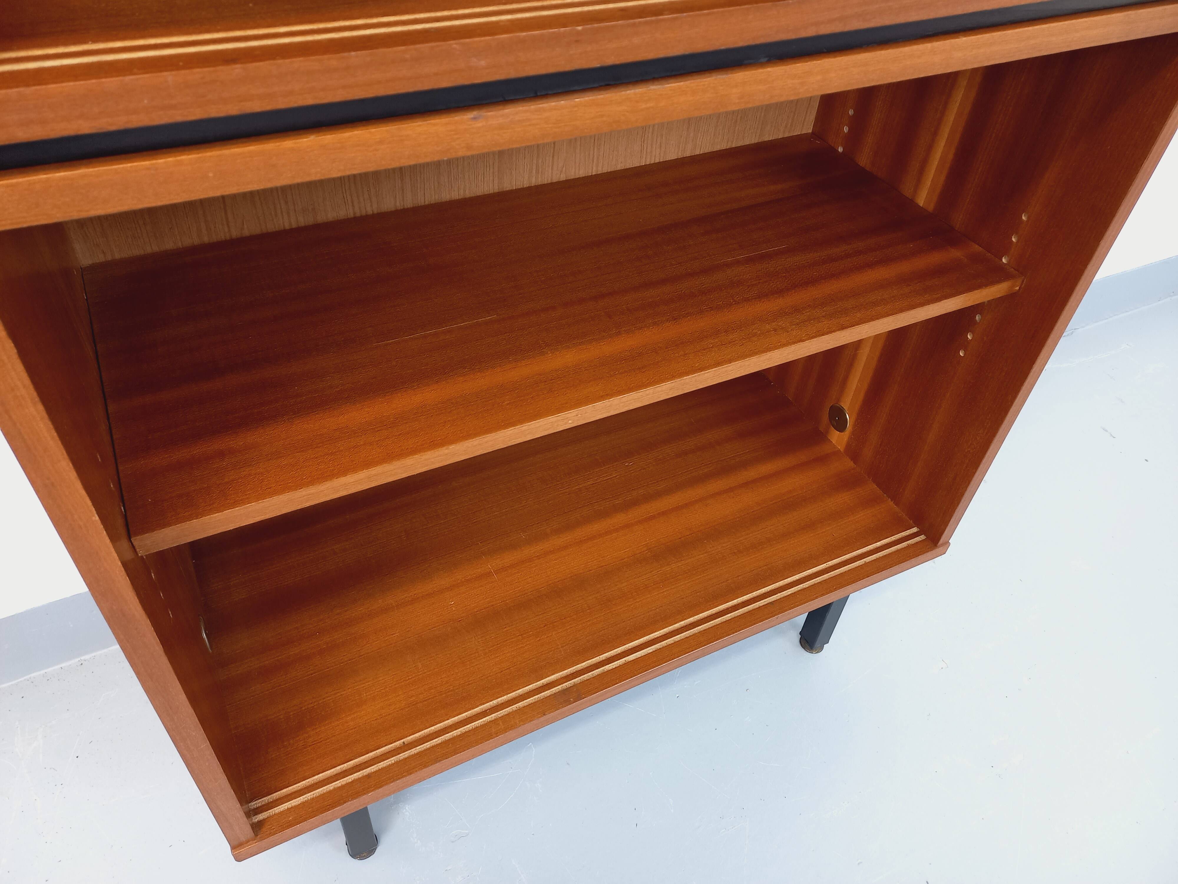 Vintage wooden bookshelf in teak style from the 1960s.
