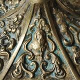 Baroque/Antique style torch candleholder, nineteenth, gilded bronze. Head motifs, volute arabesques