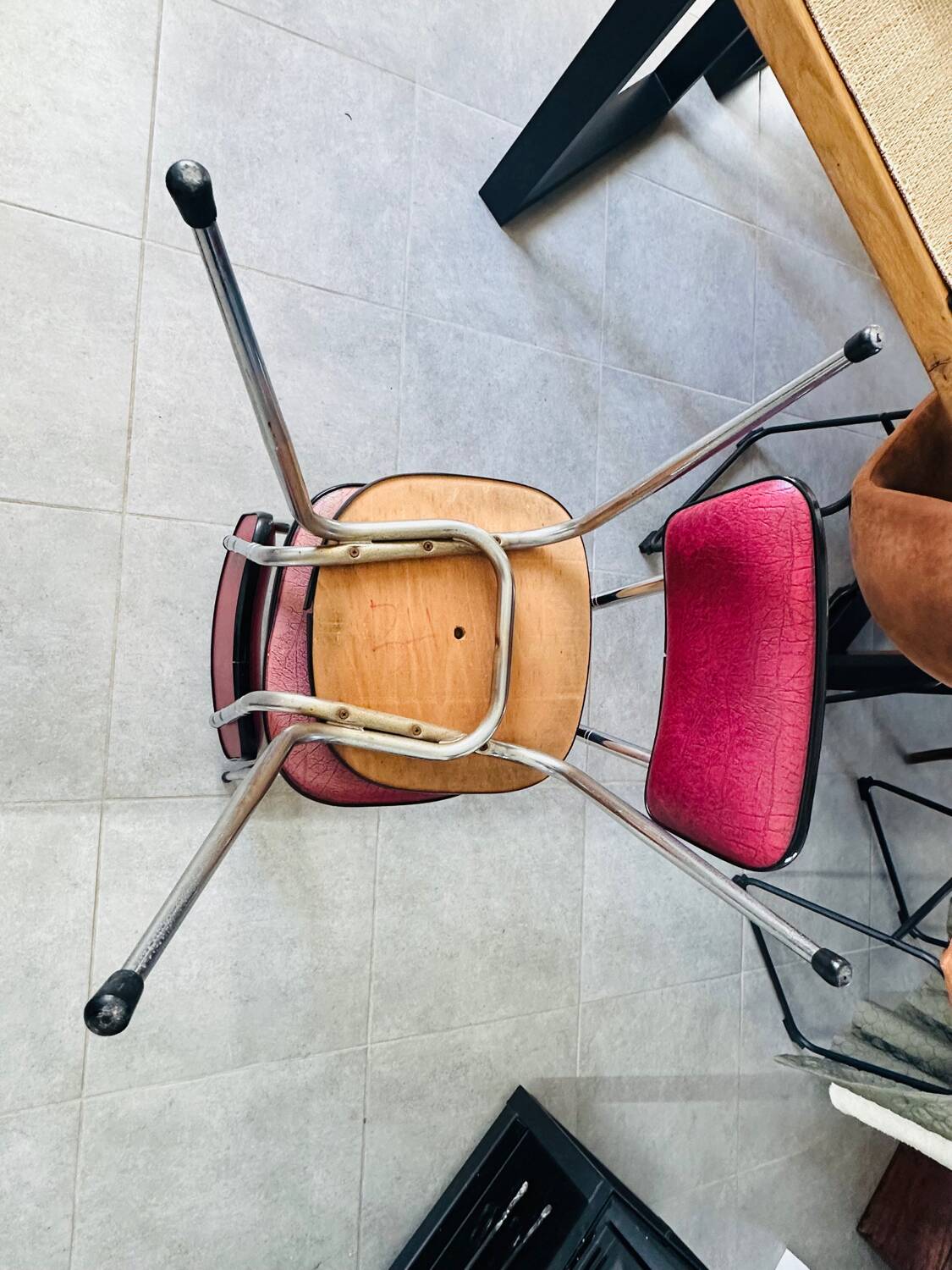Pair of raspberry-colored chairs from the 60s/70s with metal legs