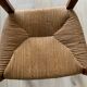Antique wood and straw armchair