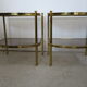 Paire de tables d’appoint en laiton et verre fumant des années 70