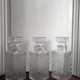3 diamond-patterned chiseled glass carafes