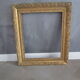 Old frame in wood and gilded stucco