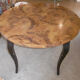 Round table art deco style - elm magnifying glass top and black wooden legs
