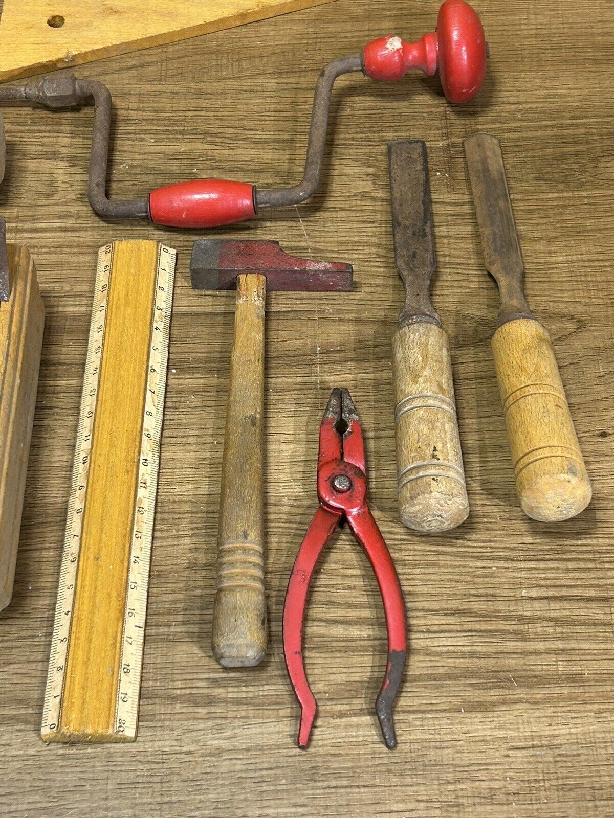 lot of antique toys, carpentry tools, wood, saw, plane, hammer,...