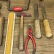 lot of antique toys, carpentry tools, wood, saw, plane, hammer,...