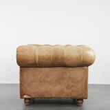 Chesterfield armchair made of cowhide leather in a light cognac colour