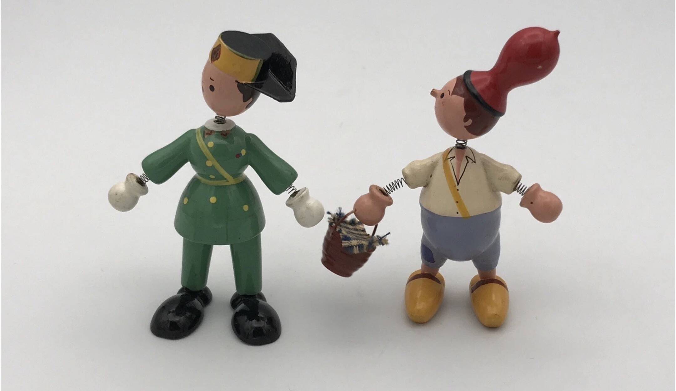 Set of 2 vintage GOULA wooden toy figurines with spring.