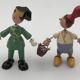 Set of 2 vintage GOULA wooden toy figurines with spring.