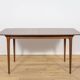 Extendable teak dining table in Mid-Century style from McIntosh, UK.