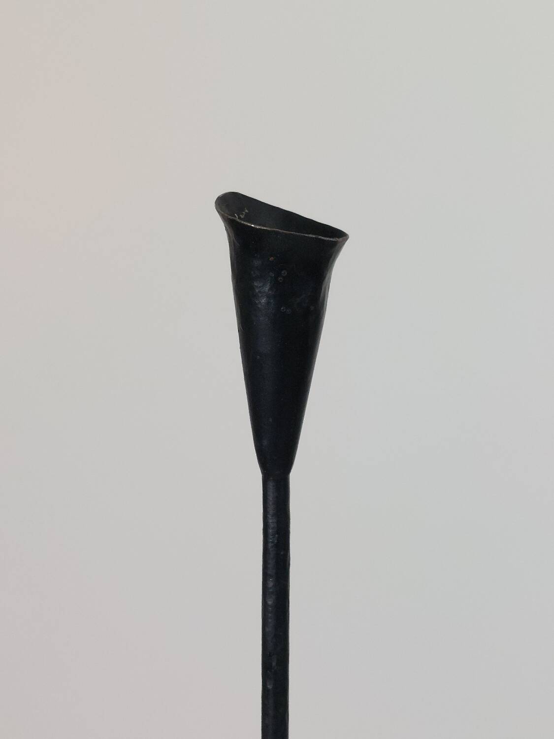 A pair of beautiful and exquisite vintage wrought iron candlesticks from the mid-century.