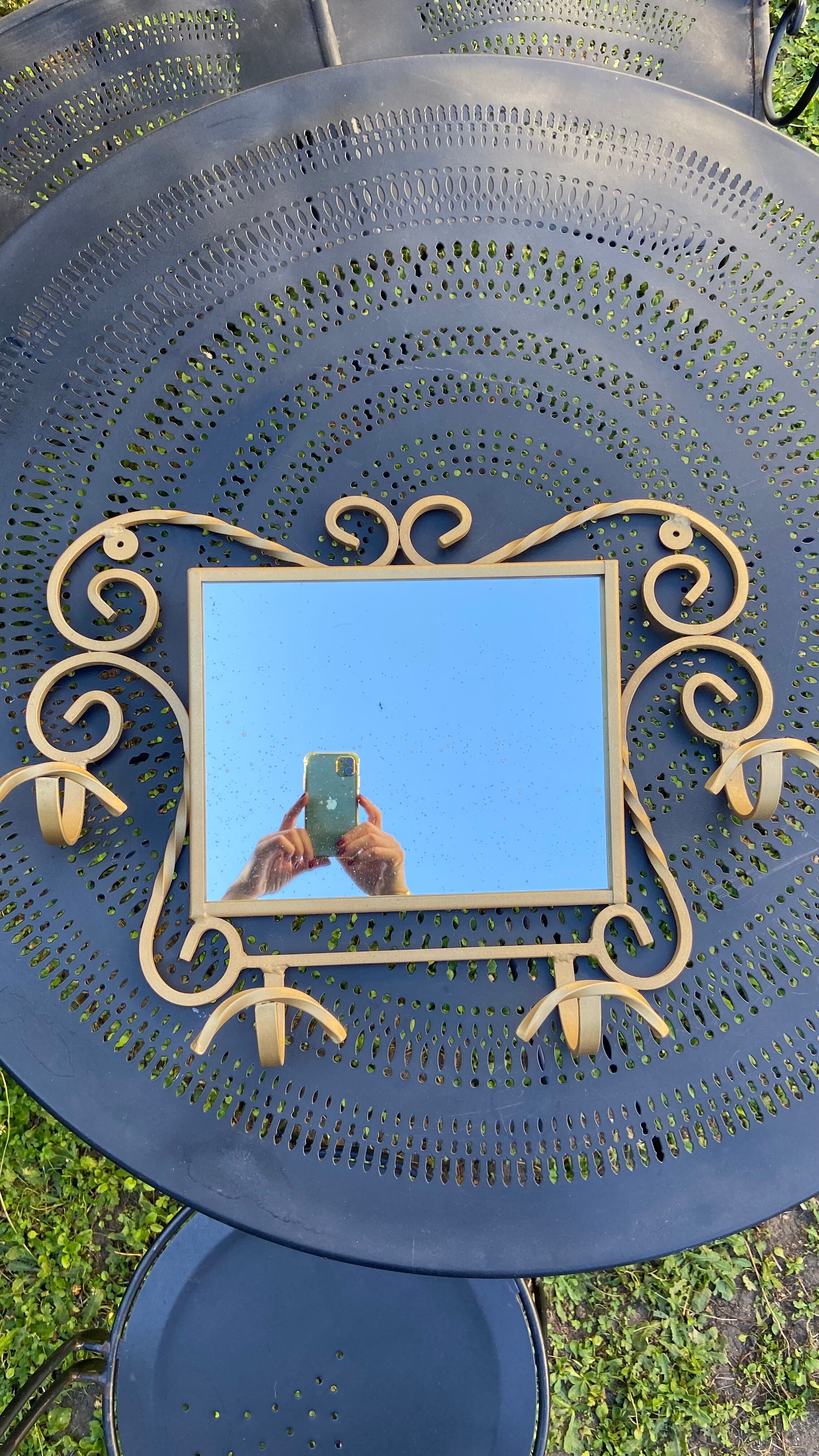 Wall-mounted gilded wrought iron coat rack with mirror