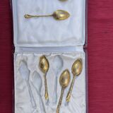 Set of golden metal spoons