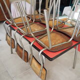 TABLE with two Italian EXTENSIONS and its 6 vintage CHAIRS of the 1970s in red color