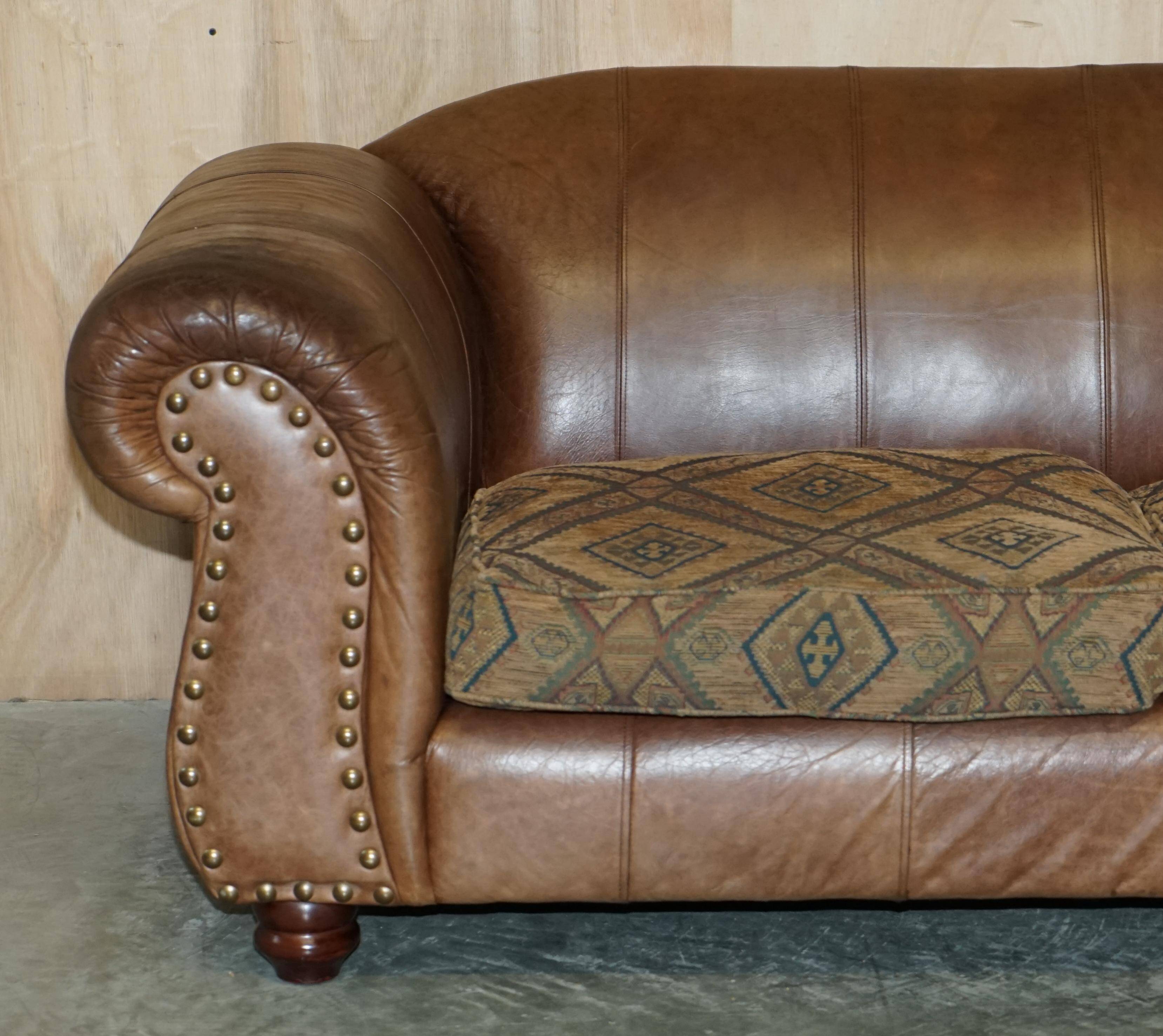Vintage leather sofas by Thomas Lloyd with Kilim cushions.
