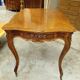 Curved desk in Louis XV style, made of carved and moulded walnut.