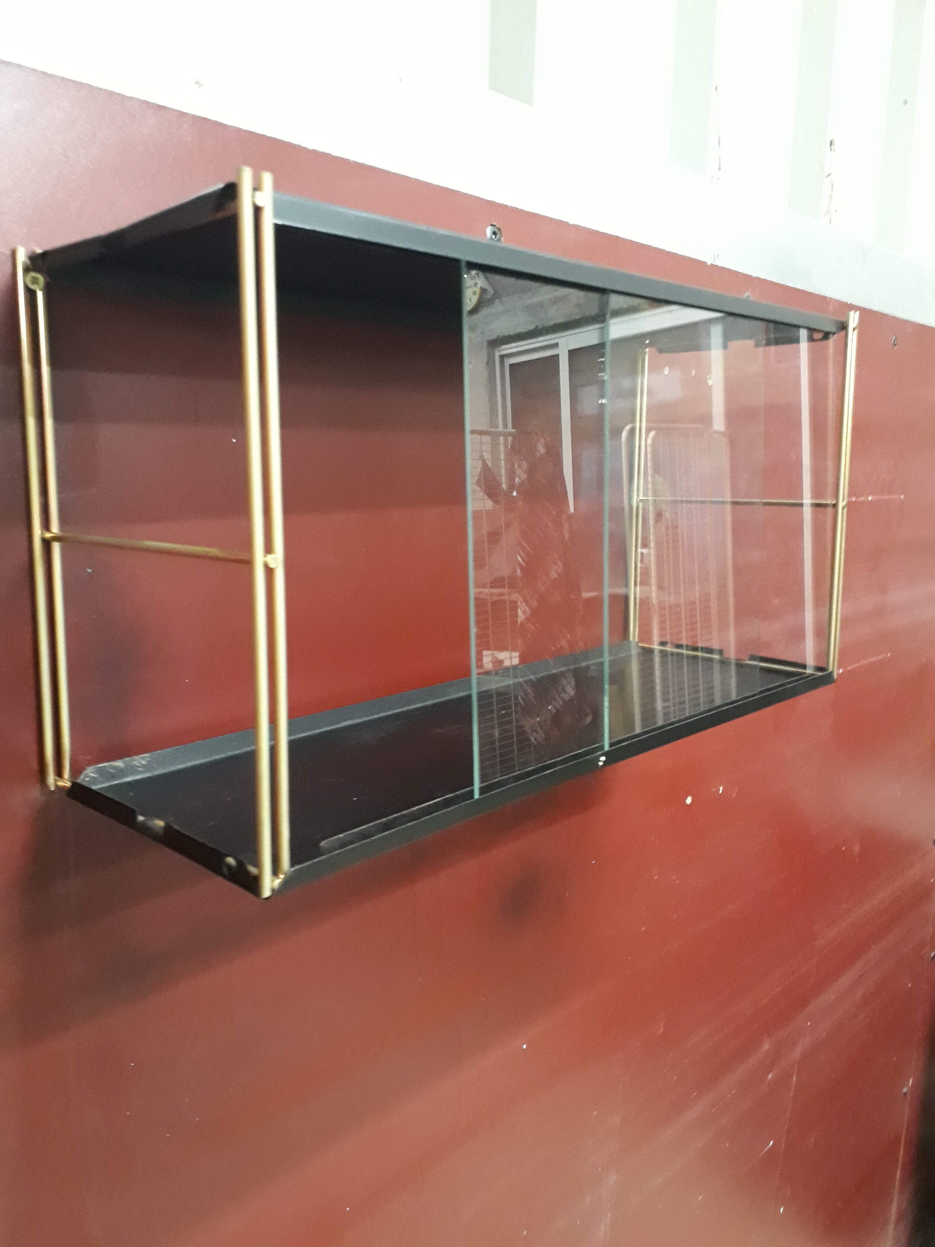 Wall-mounted Tomado showcase 1960