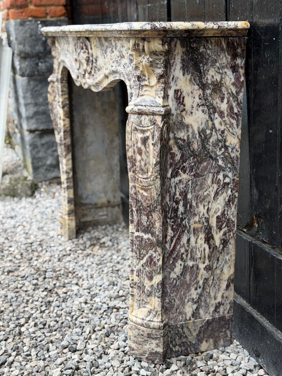 Louis XV style fireplace in Brocatelle marble, circa 1880.