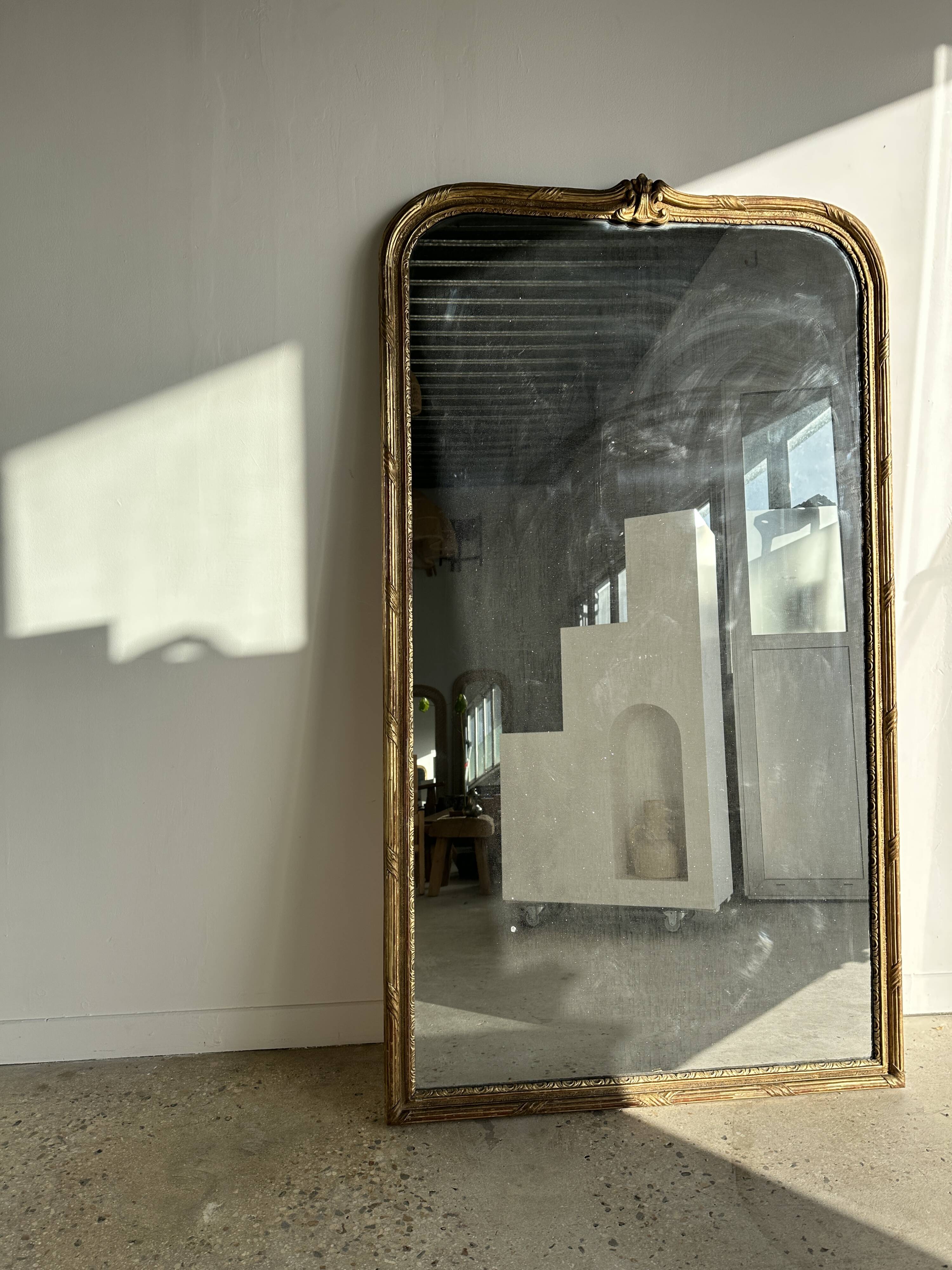 Large gilded mirror 19th century rounded corners mercury glass Louis XVI style