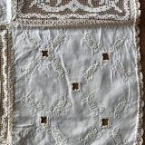 Former embroidered doily