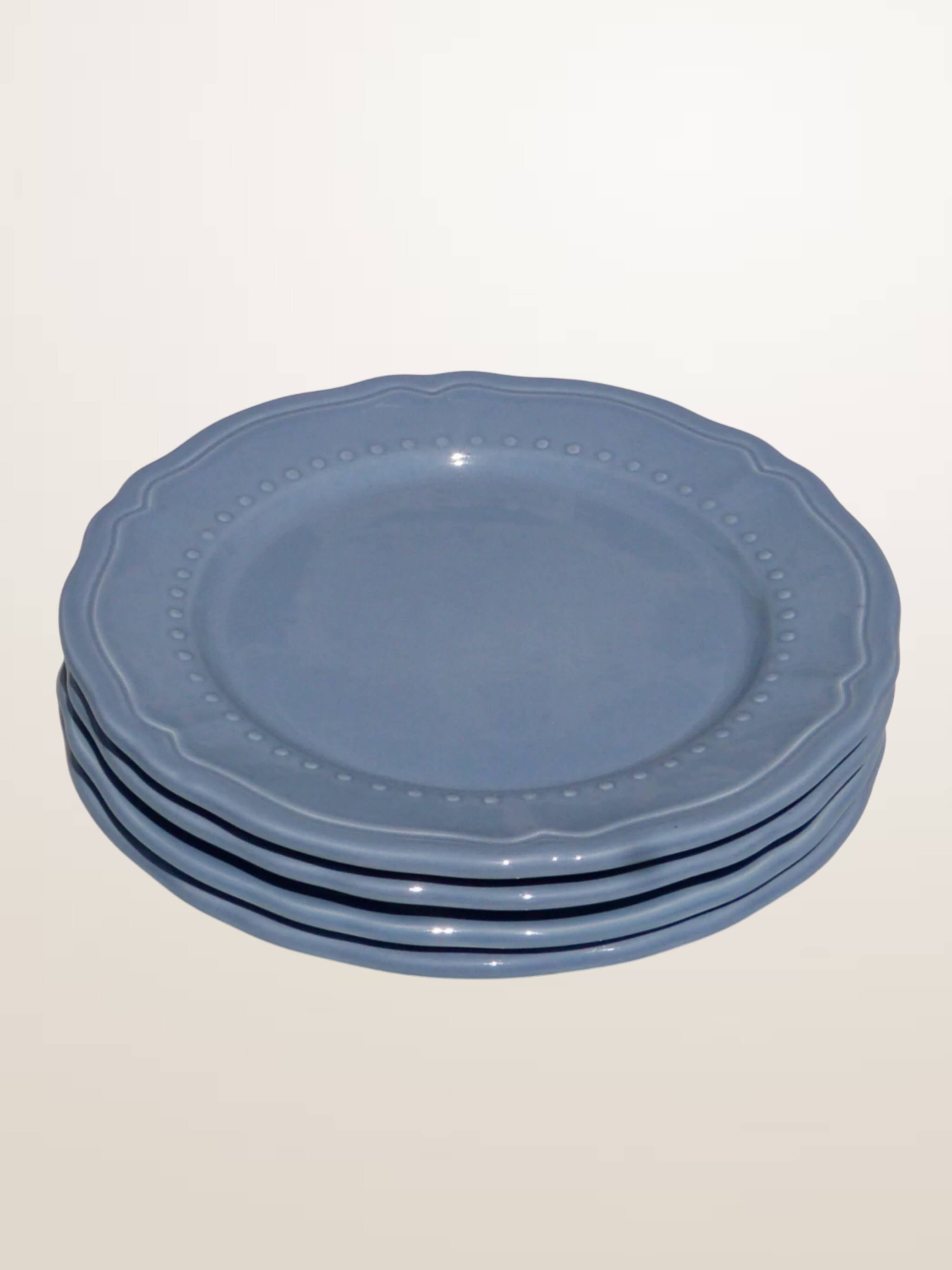Set of 4 blue ceramic dessert plates.
