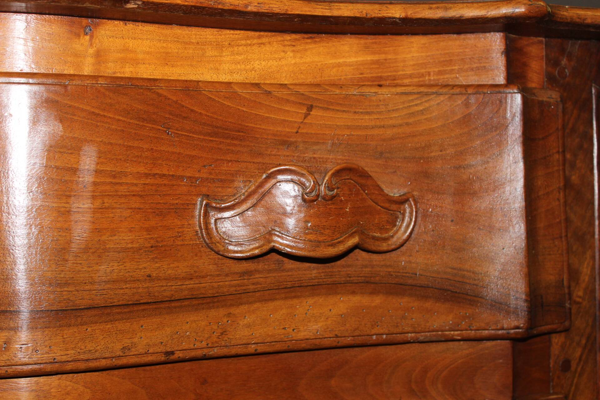 Eighteenth-century walnut crossbow commode.